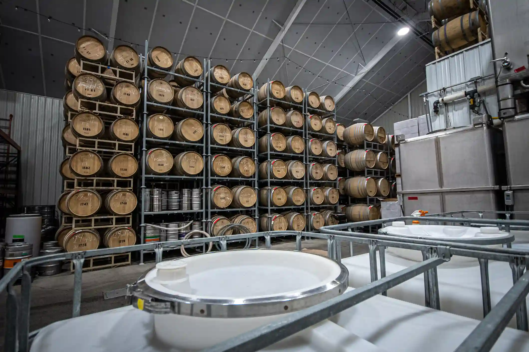 Underground wine aging cellars French oak barrels Bitcoin winery premium storage Winters California